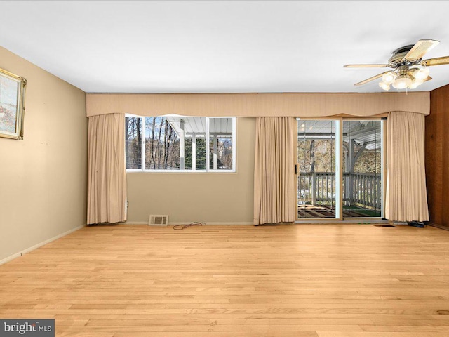 spare room with ceiling fan and light hardwood / wood-style flooring