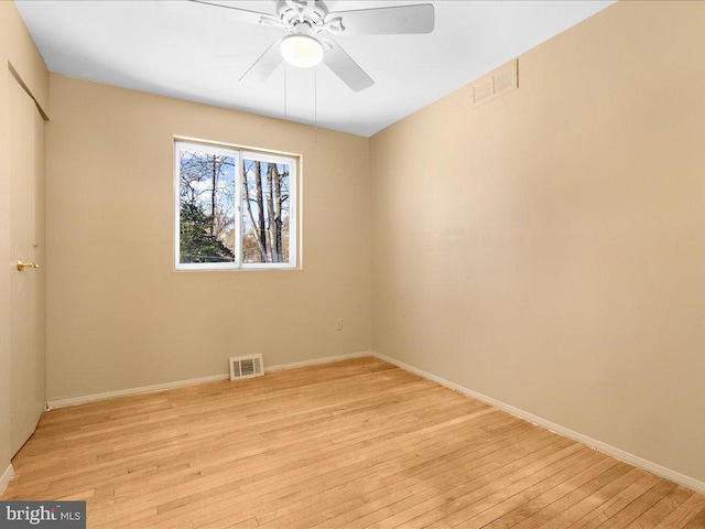 unfurnished room featuring ceiling fan and light wood-type flooring