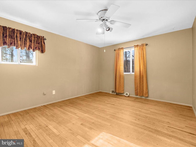 unfurnished room with light hardwood / wood-style flooring and ceiling fan