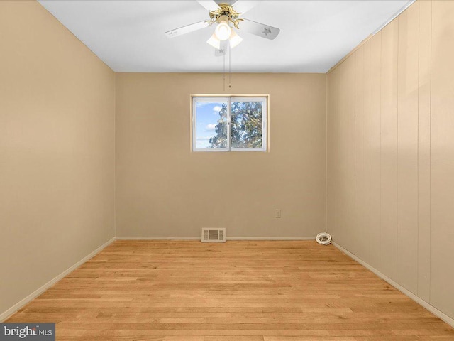 unfurnished room with light hardwood / wood-style flooring and ceiling fan