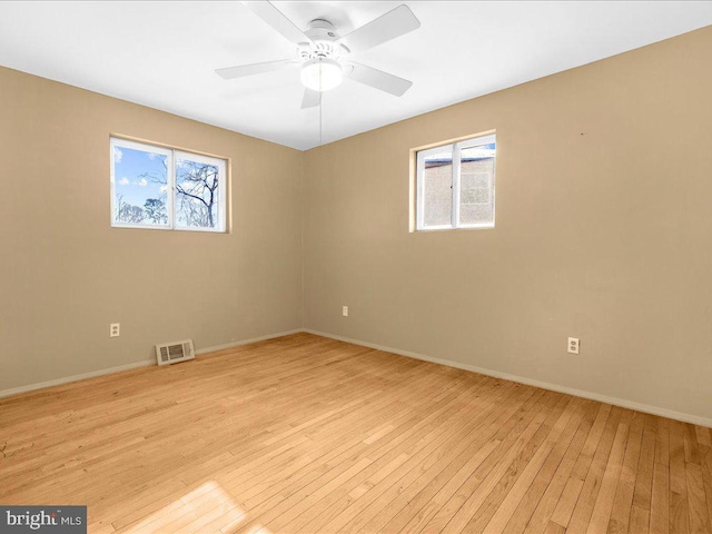 unfurnished room featuring light hardwood / wood-style flooring and ceiling fan