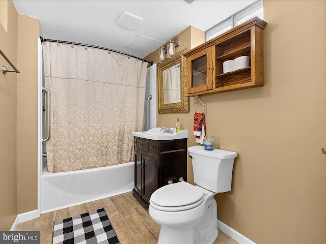 full bathroom featuring hardwood / wood-style floors, vanity, toilet, and shower / bathtub combination with curtain