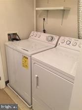 washroom featuring independent washer and dryer