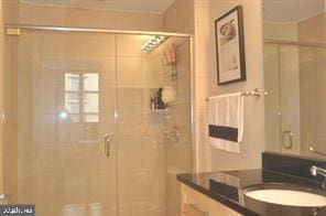 bathroom featuring vanity and walk in shower