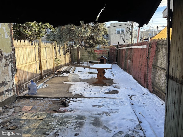 view of yard layered in snow