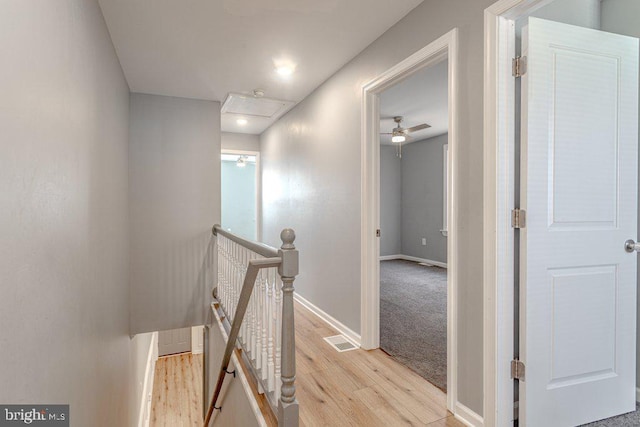 corridor with light wood-type flooring