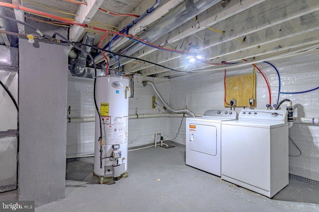 basement with washer and dryer and gas water heater