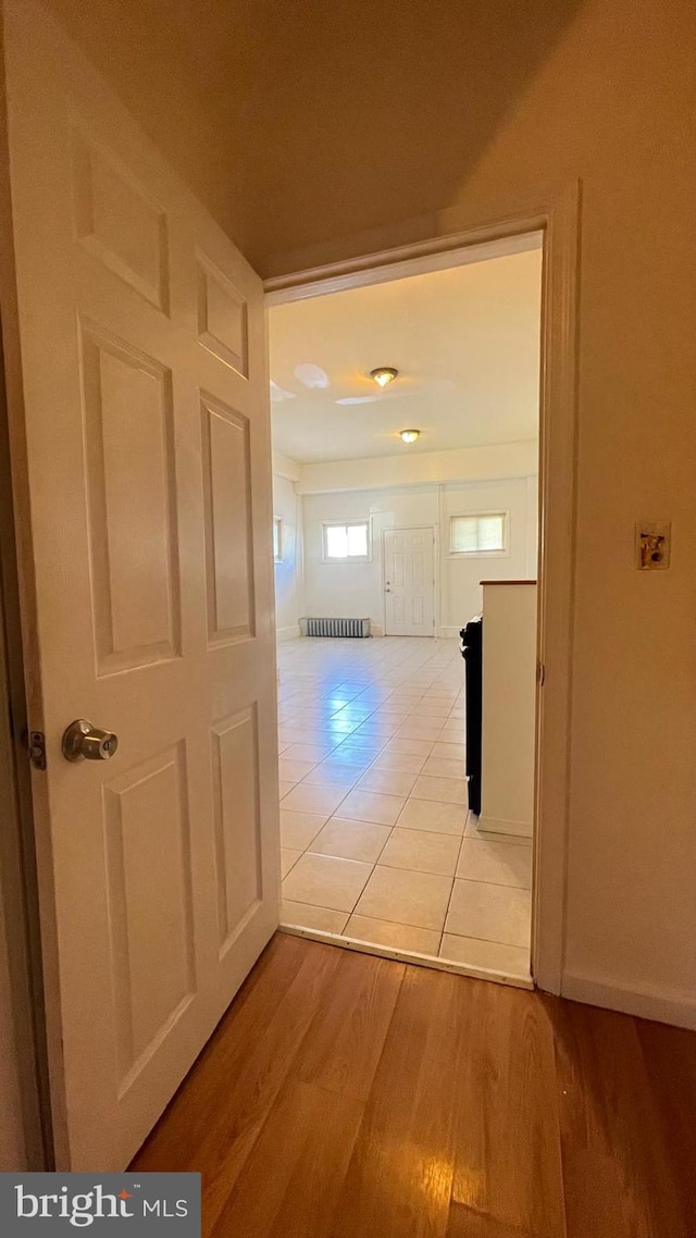 corridor featuring light hardwood / wood-style flooring