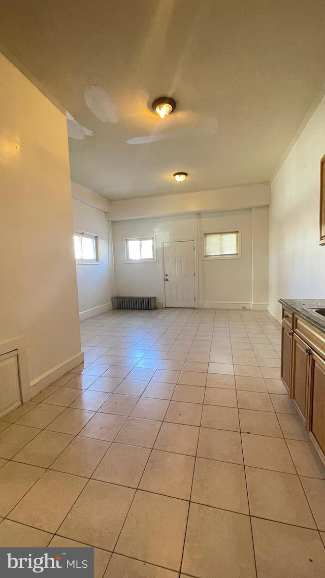 tiled entrance foyer with radiator