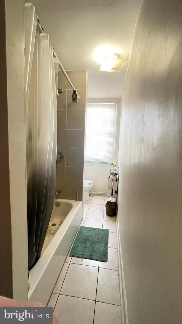 bathroom with tile patterned floors and toilet