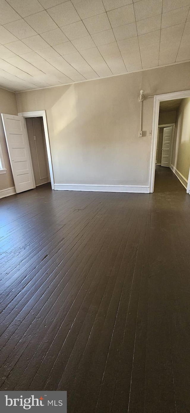 empty room featuring dark hardwood / wood-style floors