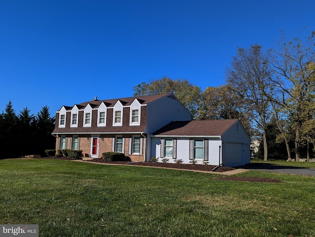 view of front facade with a garage and a front lawn