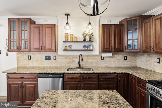 kitchen featuring decorative backsplash, sink, pendant lighting, and appliances with stainless steel finishes