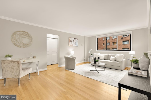 living room with hardwood / wood-style floors and ornamental molding