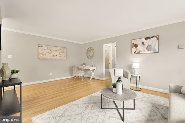 living room featuring crown molding and hardwood / wood-style flooring