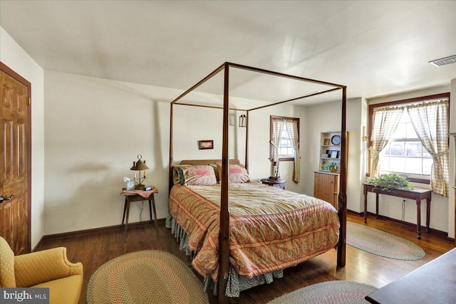 bedroom featuring dark wood-type flooring