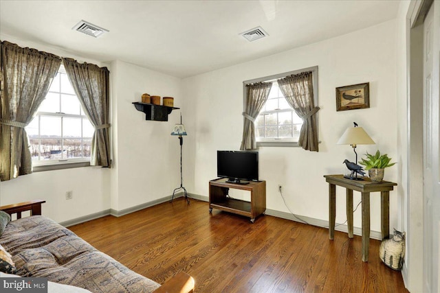 living room with dark hardwood / wood-style flooring