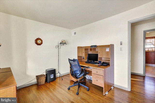 office space featuring hardwood / wood-style floors