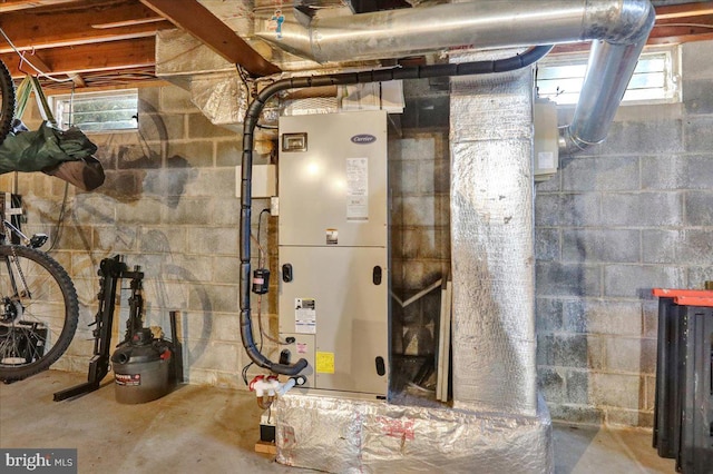 utility room featuring heating unit