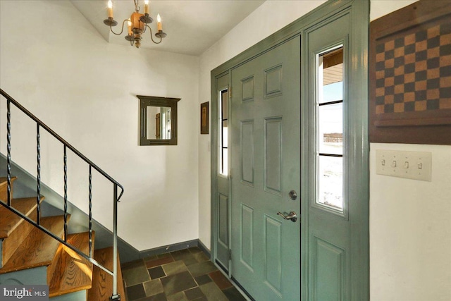 foyer featuring an inviting chandelier