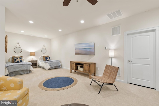 bedroom featuring ceiling fan and light carpet