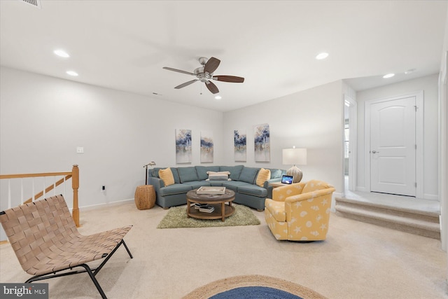 carpeted living room featuring ceiling fan