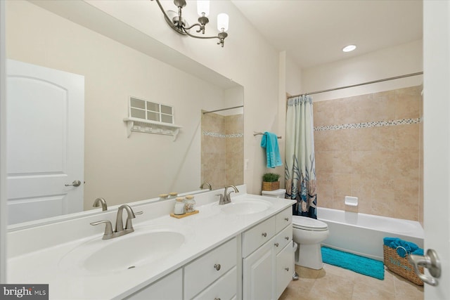 full bathroom featuring shower / bath combination with curtain, vanity, toilet, and tile patterned flooring