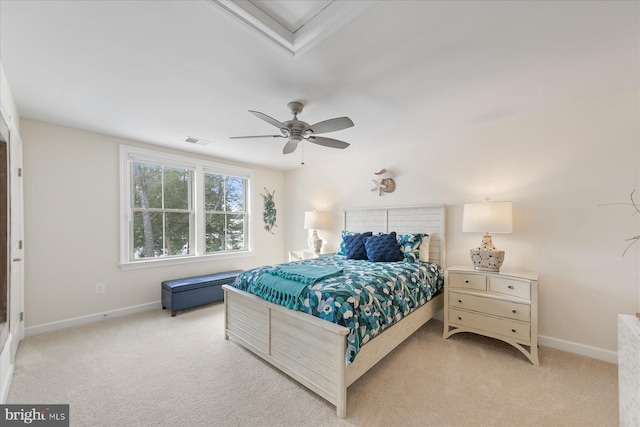 bedroom featuring light carpet and ceiling fan