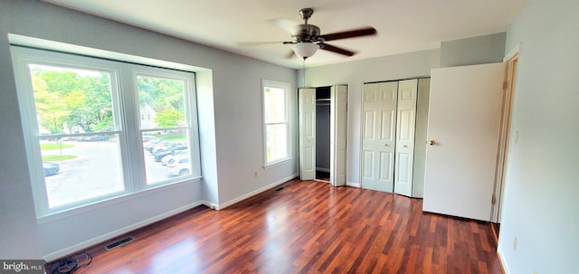 3625 Silver Spruce Cir, Burtonsville, MD 20866 - unfurnished bedroom featuring multiple windows, multiple closets, wood finished floors, and ceiling fan