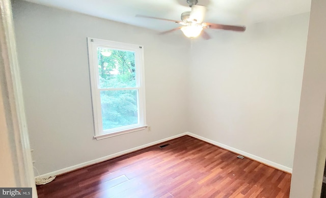 3625 Silver Spruce Cir, Burtonsville, MD 20866 - empty room featuring plenty of natural light, wood finished floors, and a ceiling fan