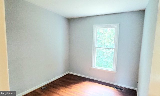 3625 Silver Spruce Cir, Burtonsville, MD 20866 - unfurnished room with healthy amount of natural light and dark wood finished floors