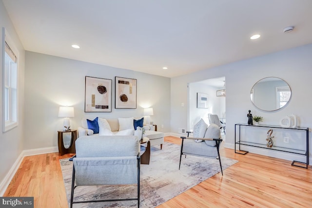 living room featuring plenty of natural light and light wood-type flooring