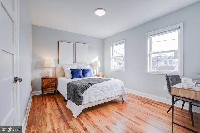 bedroom with light wood-type flooring