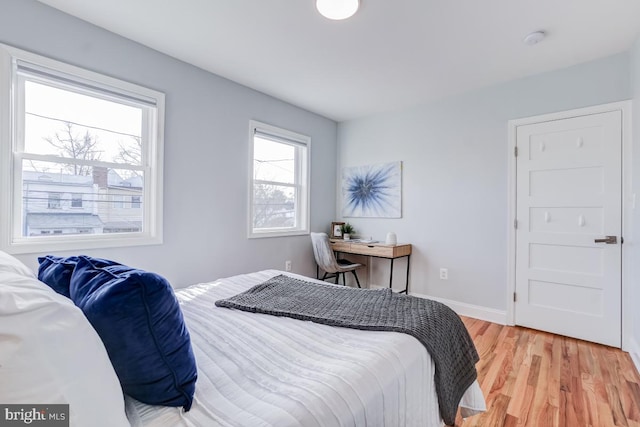 bedroom with light wood-type flooring