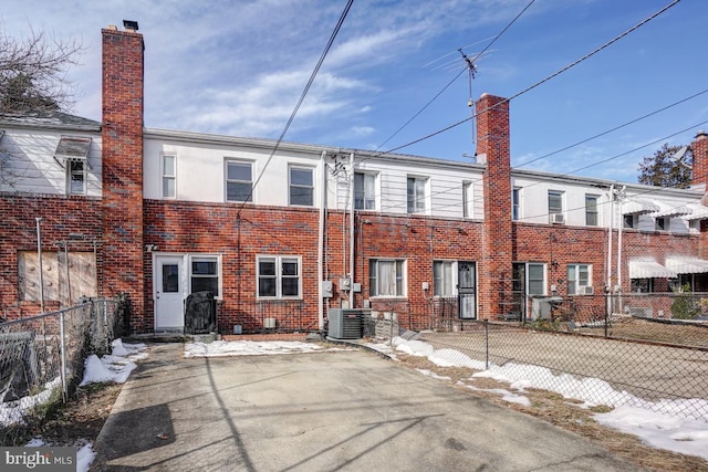 rear view of property with central air condition unit