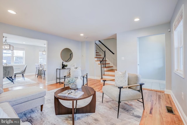 living room with light hardwood / wood-style flooring