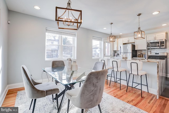 dining area featuring light wood-type flooring