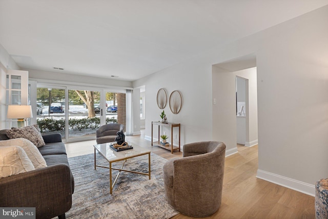 living room with light hardwood / wood-style flooring