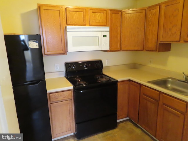 kitchen with sink and black appliances