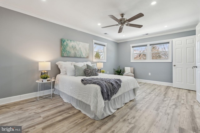 bedroom featuring light wood-type flooring, ceiling fan, and crown molding