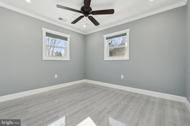 unfurnished room featuring light hardwood / wood-style flooring, plenty of natural light, ornamental molding, and ceiling fan