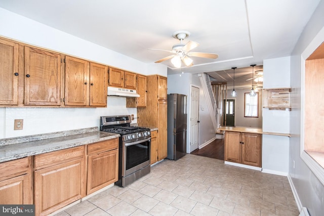 kitchen with kitchen peninsula, decorative light fixtures, stainless steel appliances, and ceiling fan