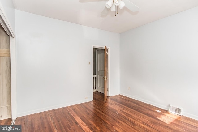 unfurnished bedroom with ceiling fan and dark hardwood / wood-style flooring