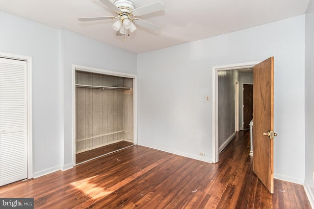 unfurnished bedroom featuring ceiling fan and dark hardwood / wood-style flooring