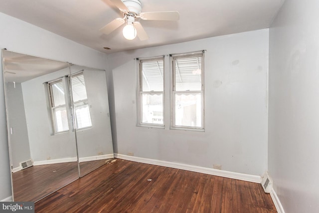 empty room featuring ceiling fan and hardwood / wood-style flooring