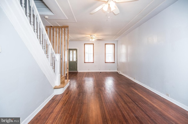 interior space with ceiling fan and dark hardwood / wood-style flooring