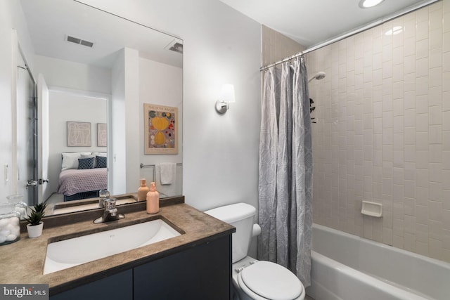 full bathroom featuring vanity, toilet, and shower / bath combo with shower curtain