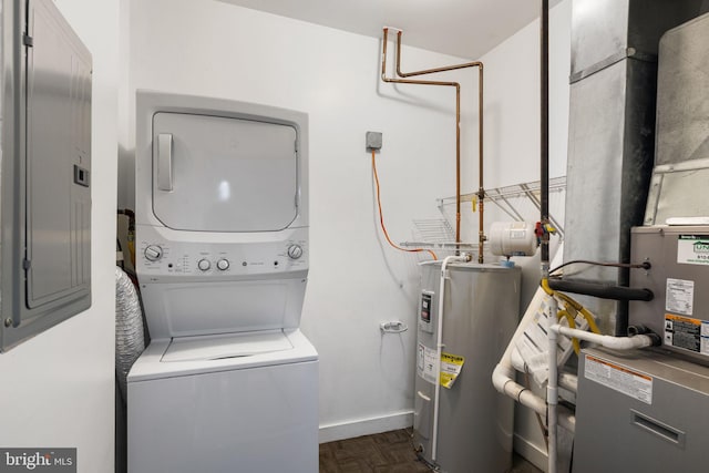 laundry room with dark parquet floors, electric panel, stacked washer and clothes dryer, and water heater