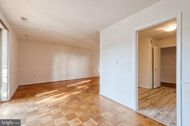 spare room featuring light parquet floors