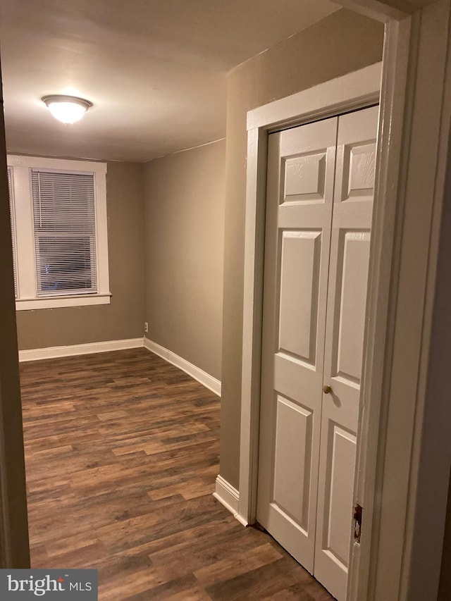 hall with dark hardwood / wood-style floors